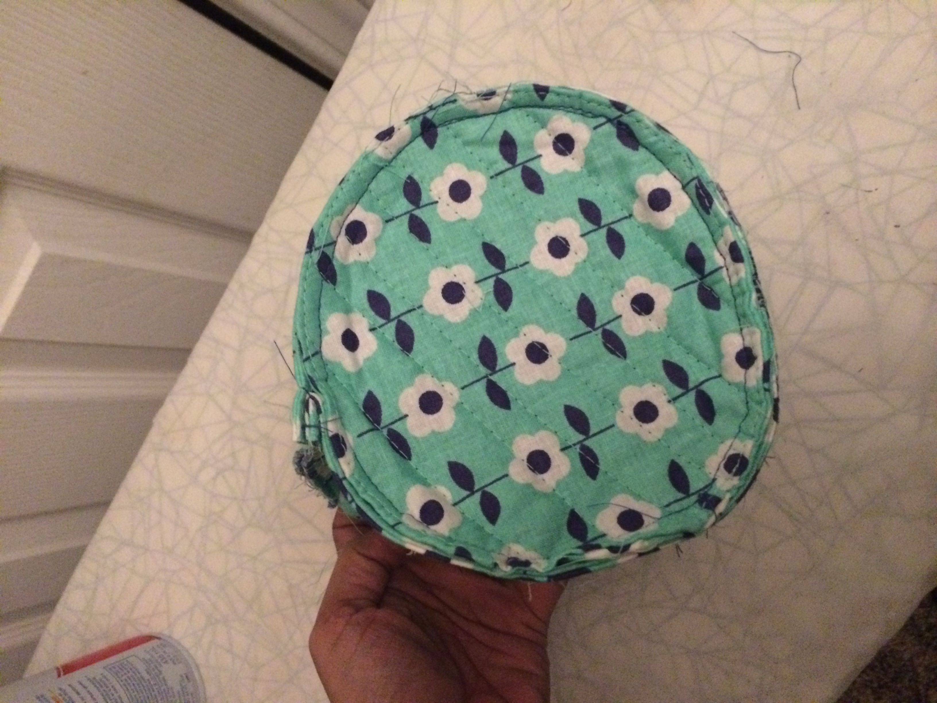 how-to-make-a-round-quilted-makeup-bag-with-inside-pockets-free-pattern-the-stitching-scientist