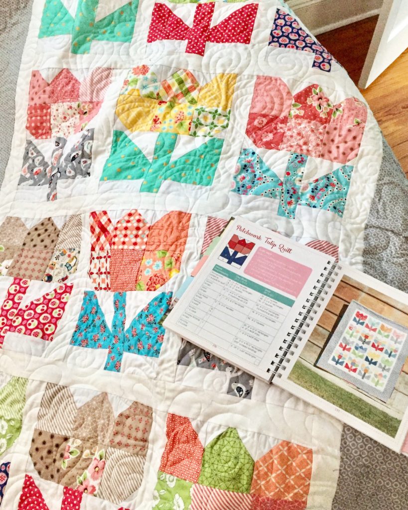 Patchwork Tulip Quilt and Planner on couch